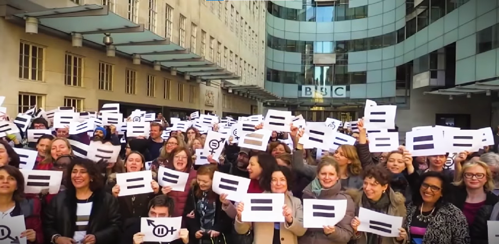 caption of women journalists outside the bbc headquarters